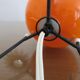 Tripod lamp "Sputnik" in orange opaline and black lacquered metal 60s 70s