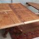 English oval table with 19th century mahogany extensions