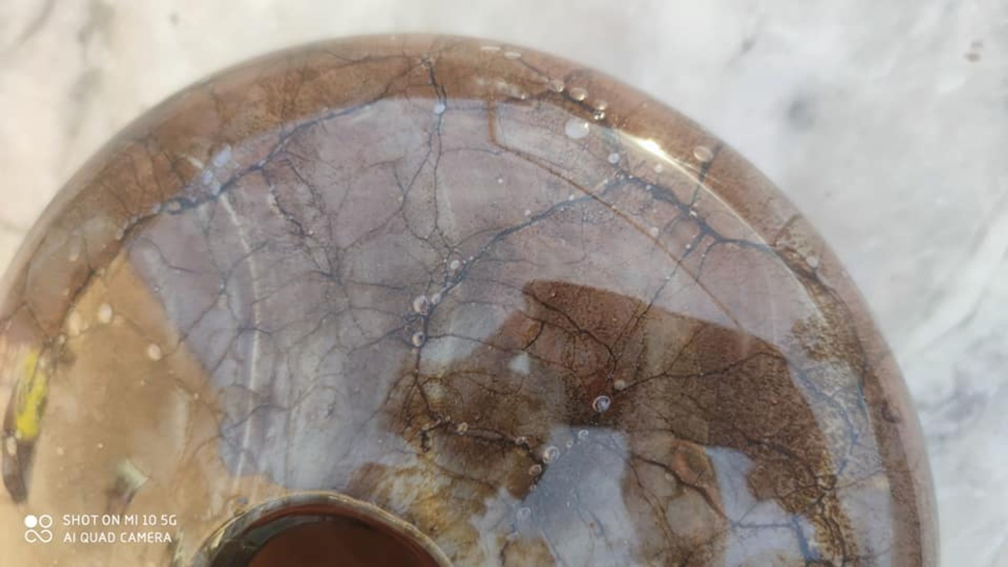 Flattened spherical vase made of glass paste