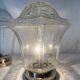 Pair of lantern-style ceiling lights or antique lamps.