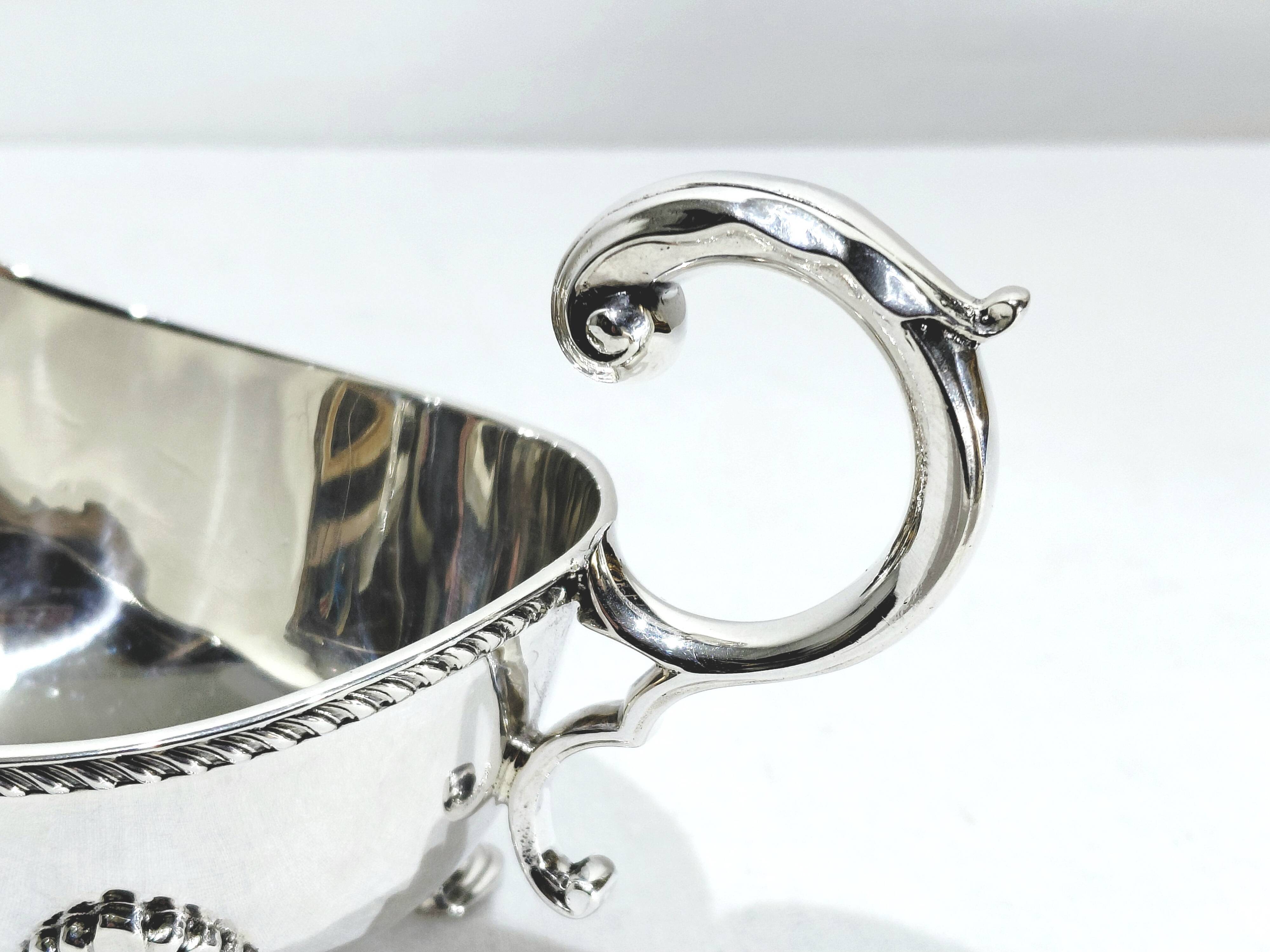 Silver sauceboat, England