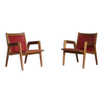 Pair of red Jacques Hauville armchairs 1950