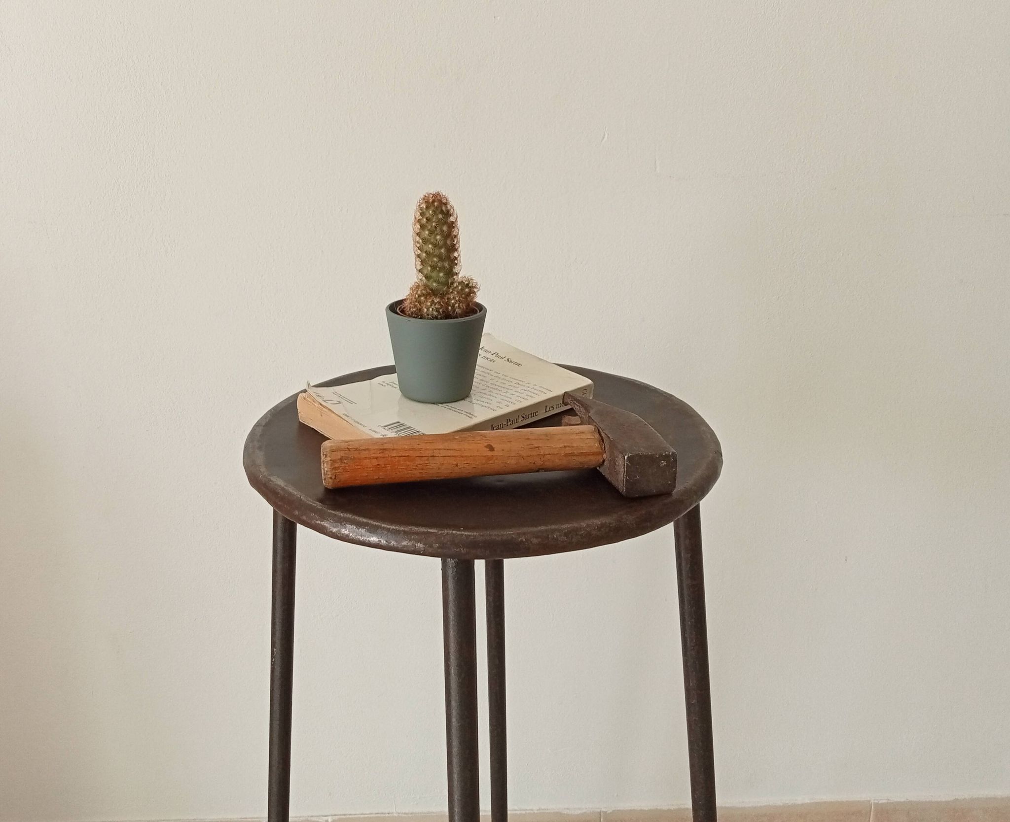 Brutalist high stool from the 1960s in solid steel.