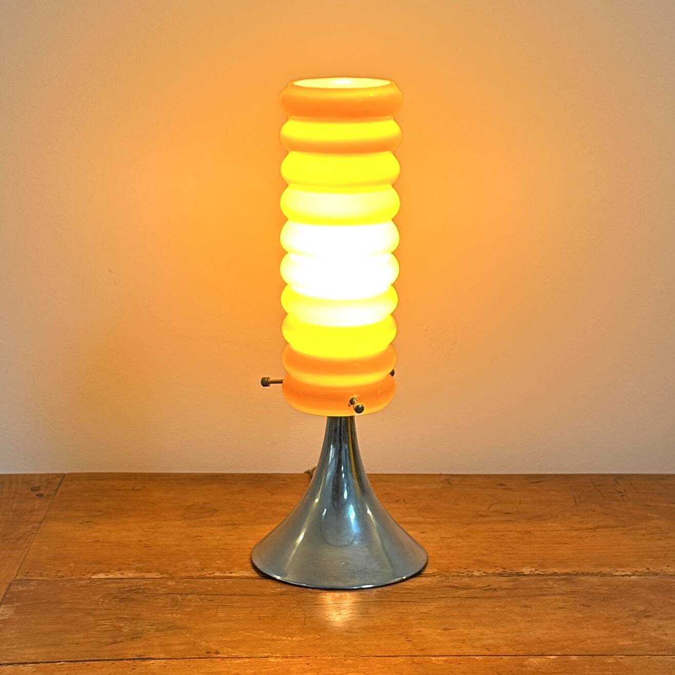 Vintage orange lamp with chrome tulip base and glass shade