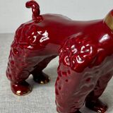 Burgundy and gold ceramic dog
