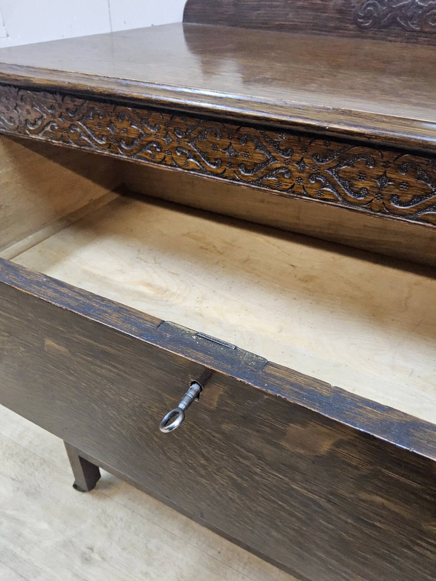 Antique chest of drawers on wheels with wood carving (key top drawer)