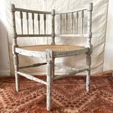 19th-century corner fireplace armchair, wood and cane.