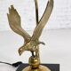 Brass lamp on black lacquered wooden base