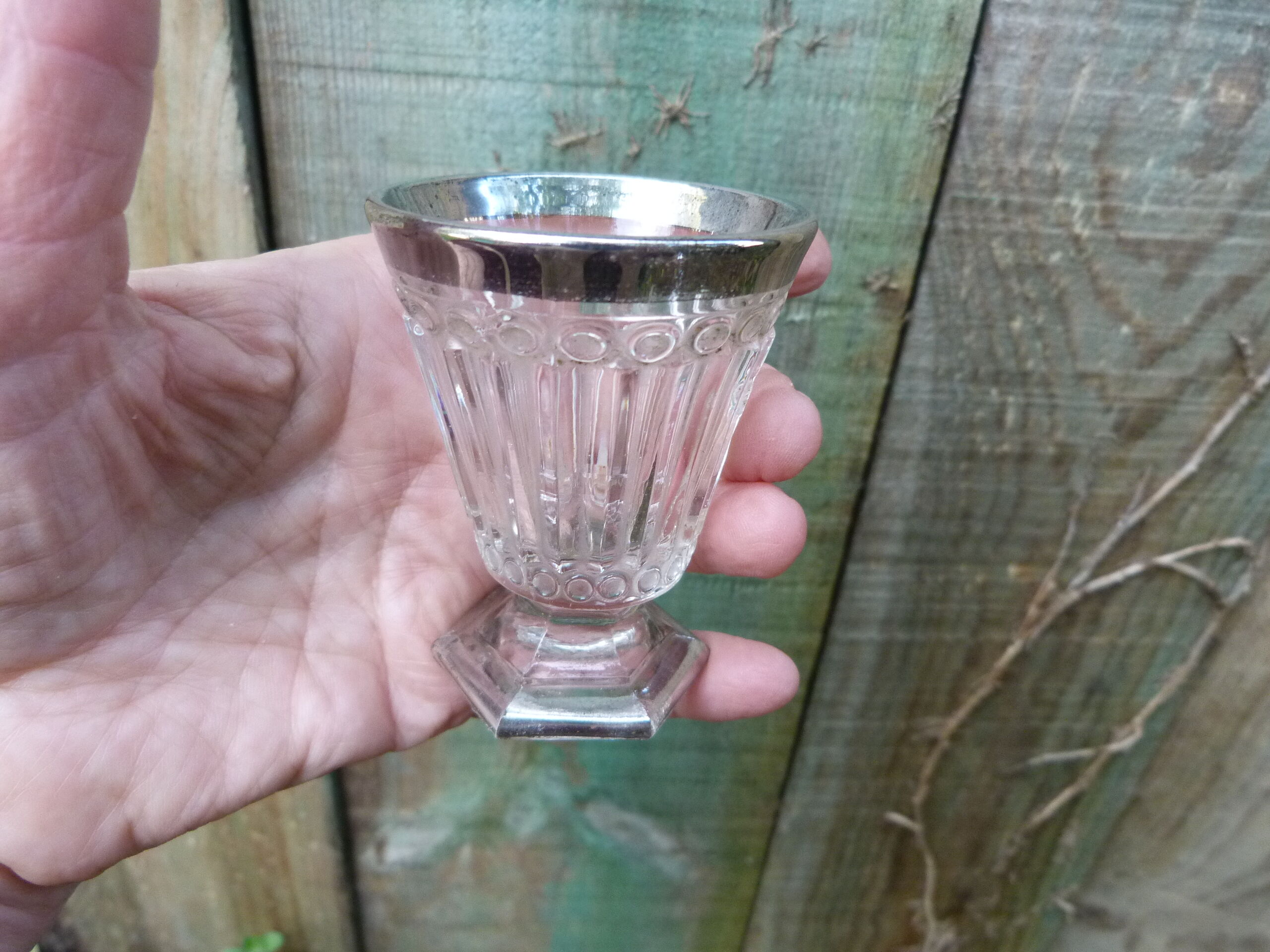 Stemmed glass for antique glass liquor with silver sides and patterns