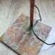 old lamp with stone base and copper arm