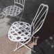 Antique garden furniture in solid wrought iron.