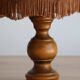 Lampe à poser en bois tourné et abat-jour en peau style parapluie