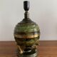 Art Deco table lamp in patinated bronze with eagles holding a globe, France 1940.