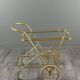 Rolling table cart in brass and glass, 20th century