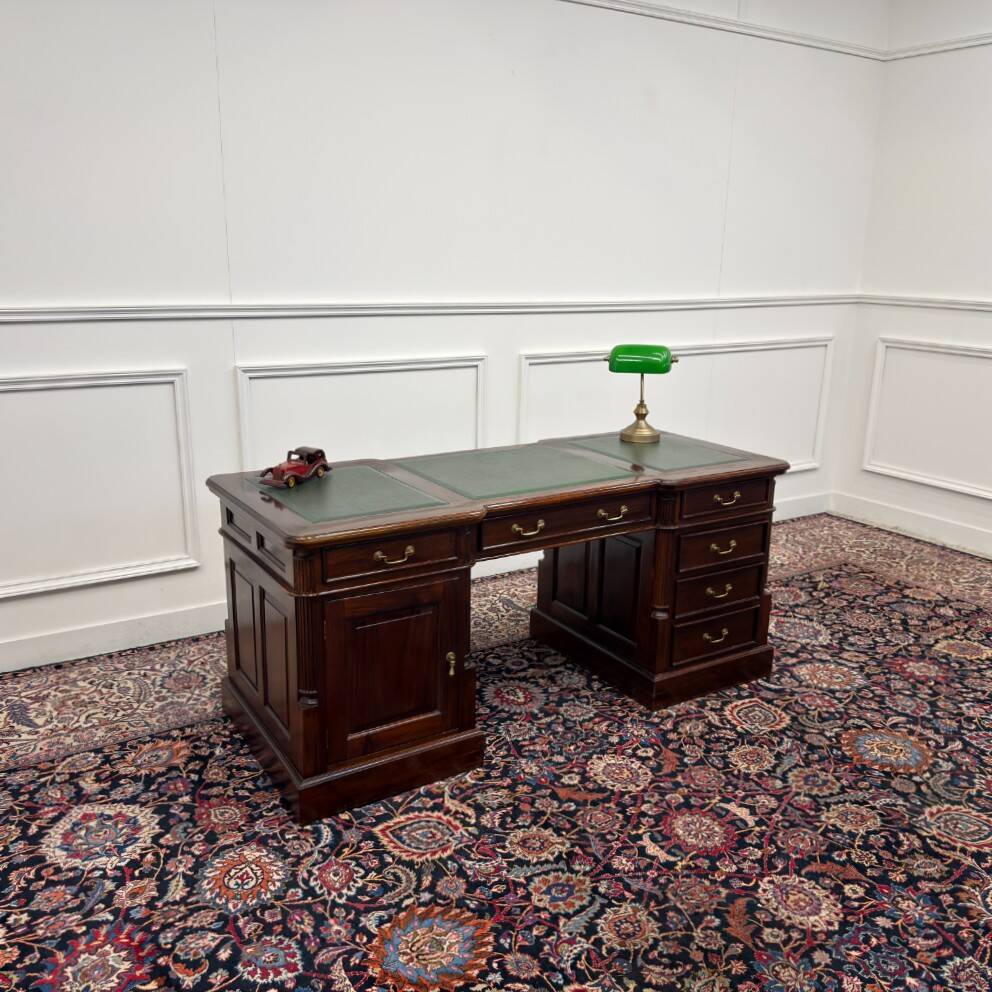 Classic English desk with green leather inlay.