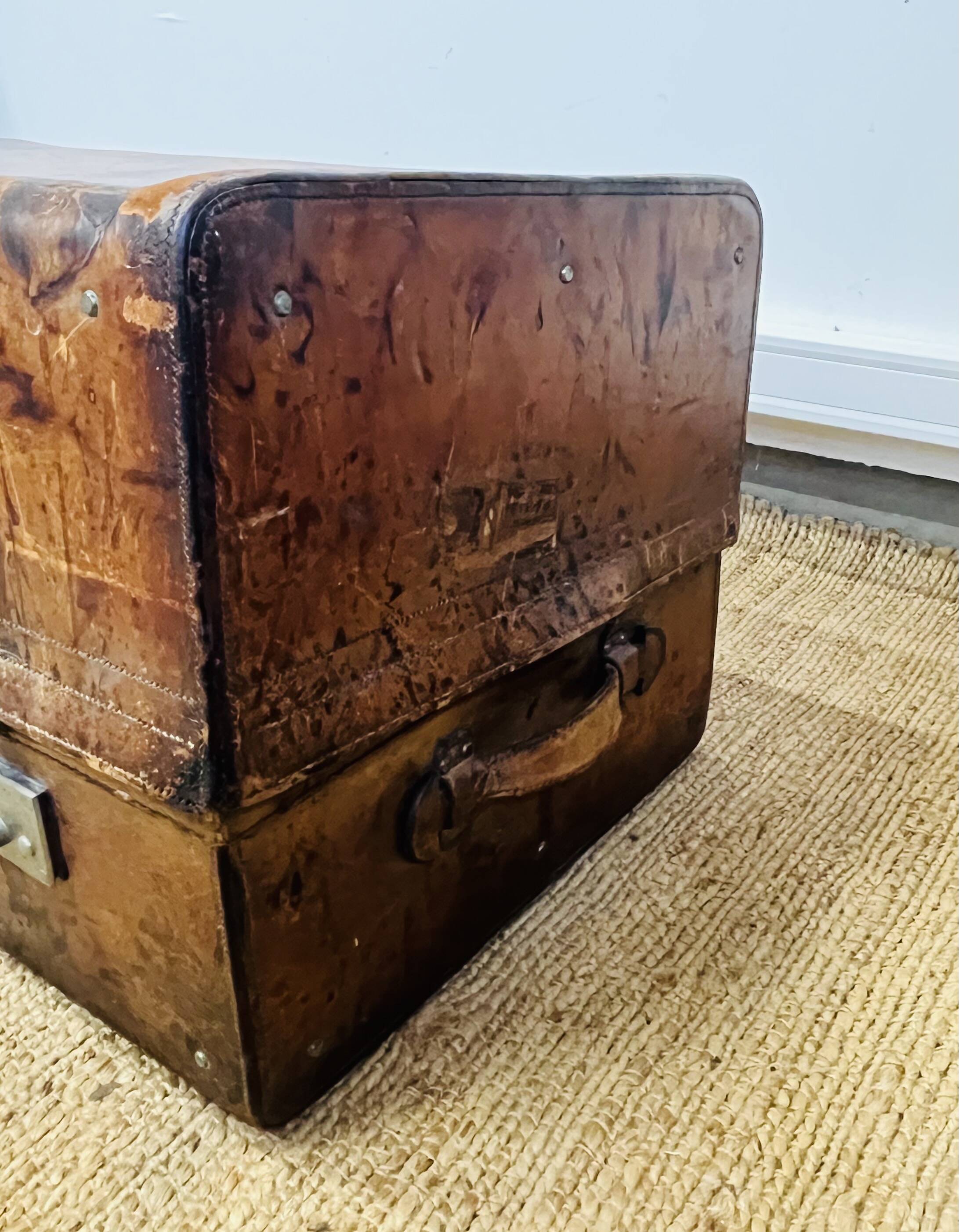 Large Gustave Keller leather trunk with multiple compartments