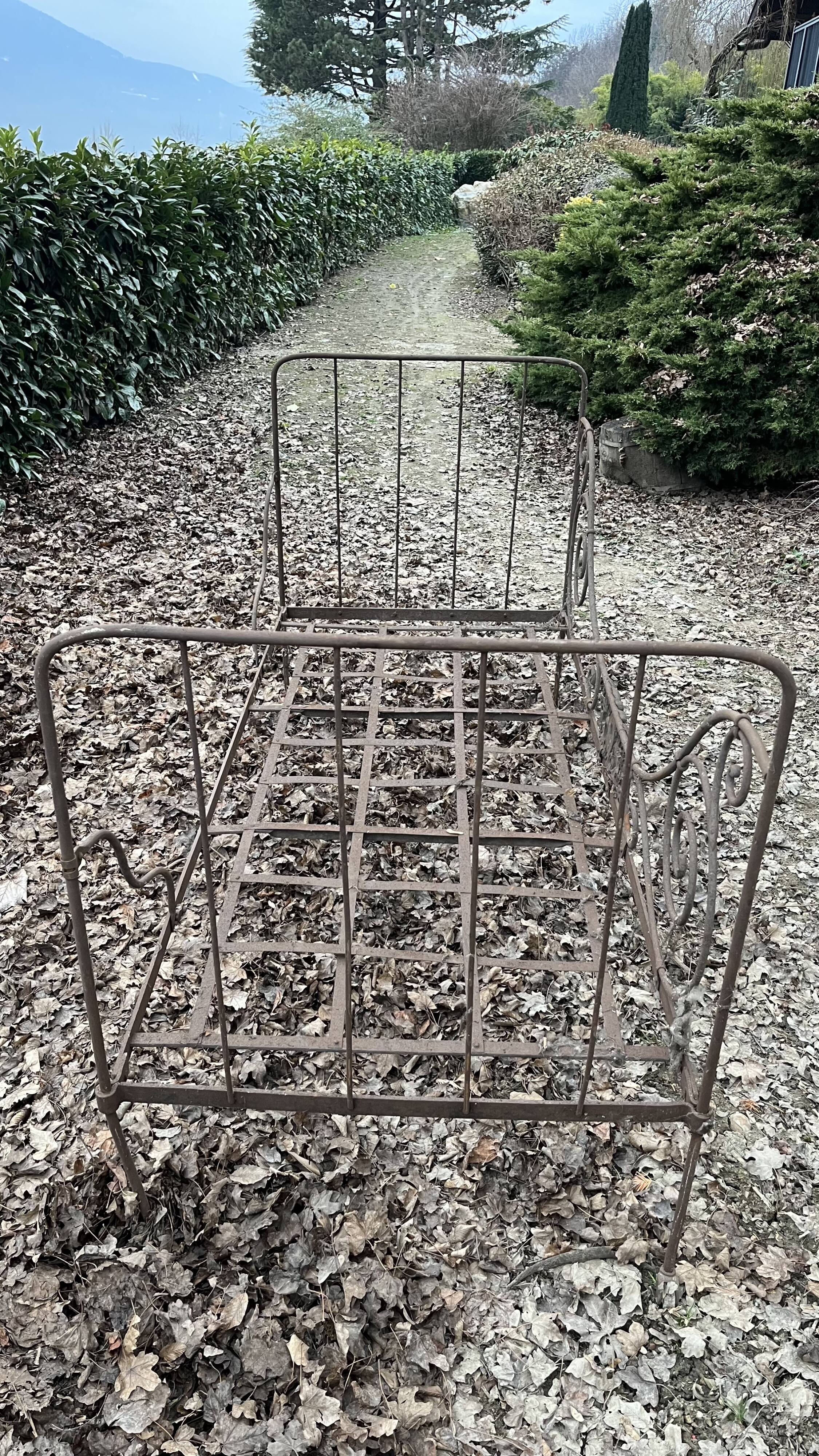 Folding wrought iron bed 1900