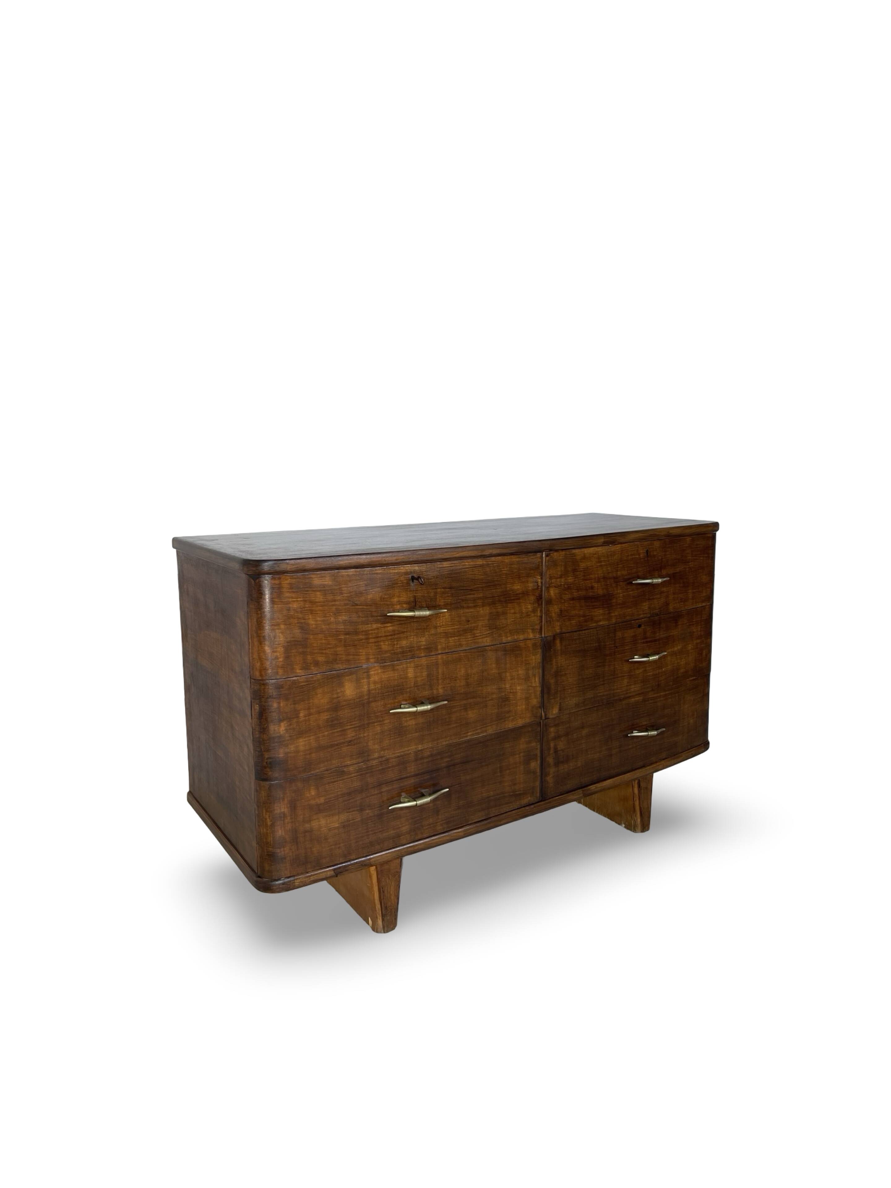 A vintage Italian chest of drawers, made of veneered walnut and solid wood,