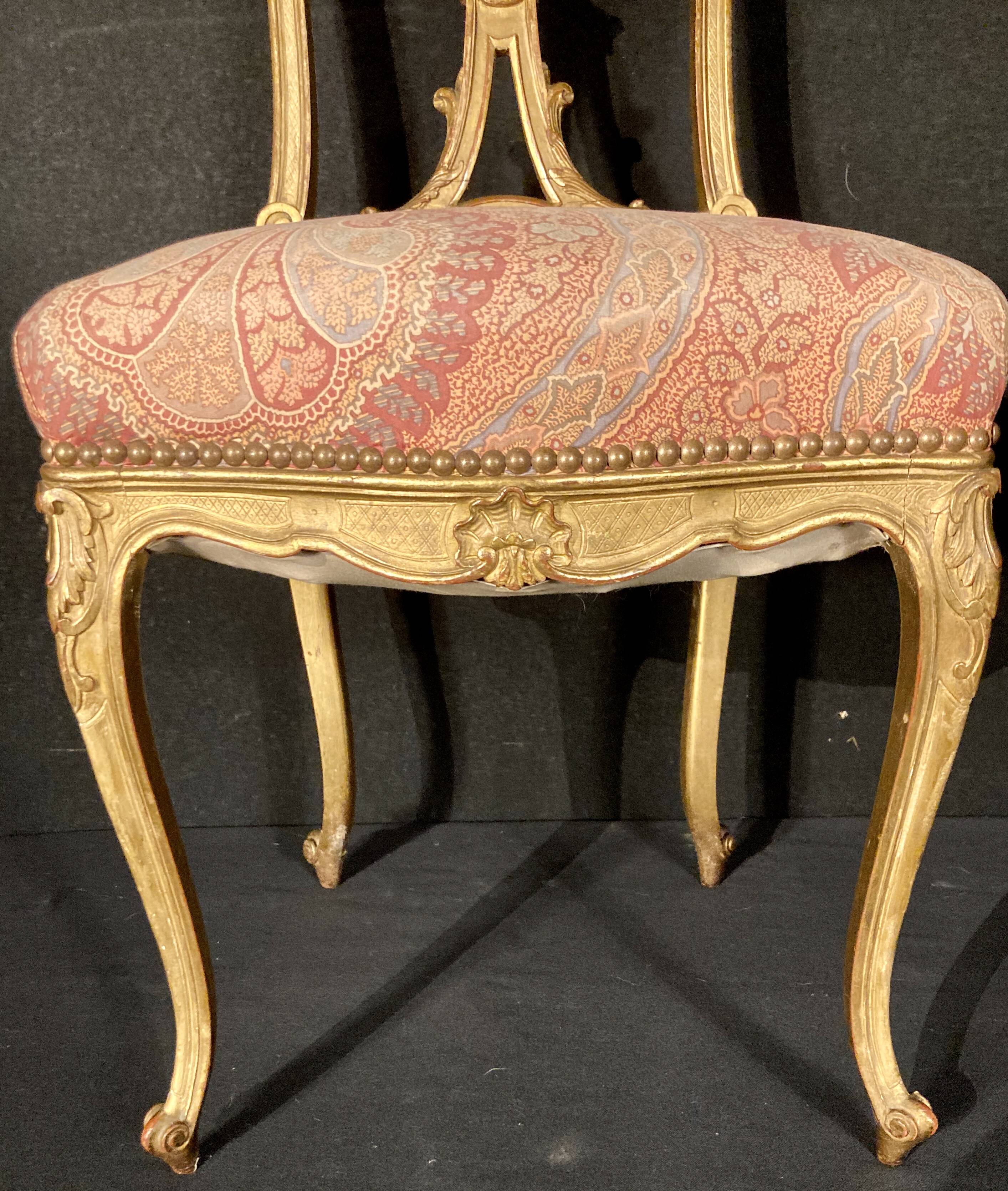 Pair of gilded wooden chairs