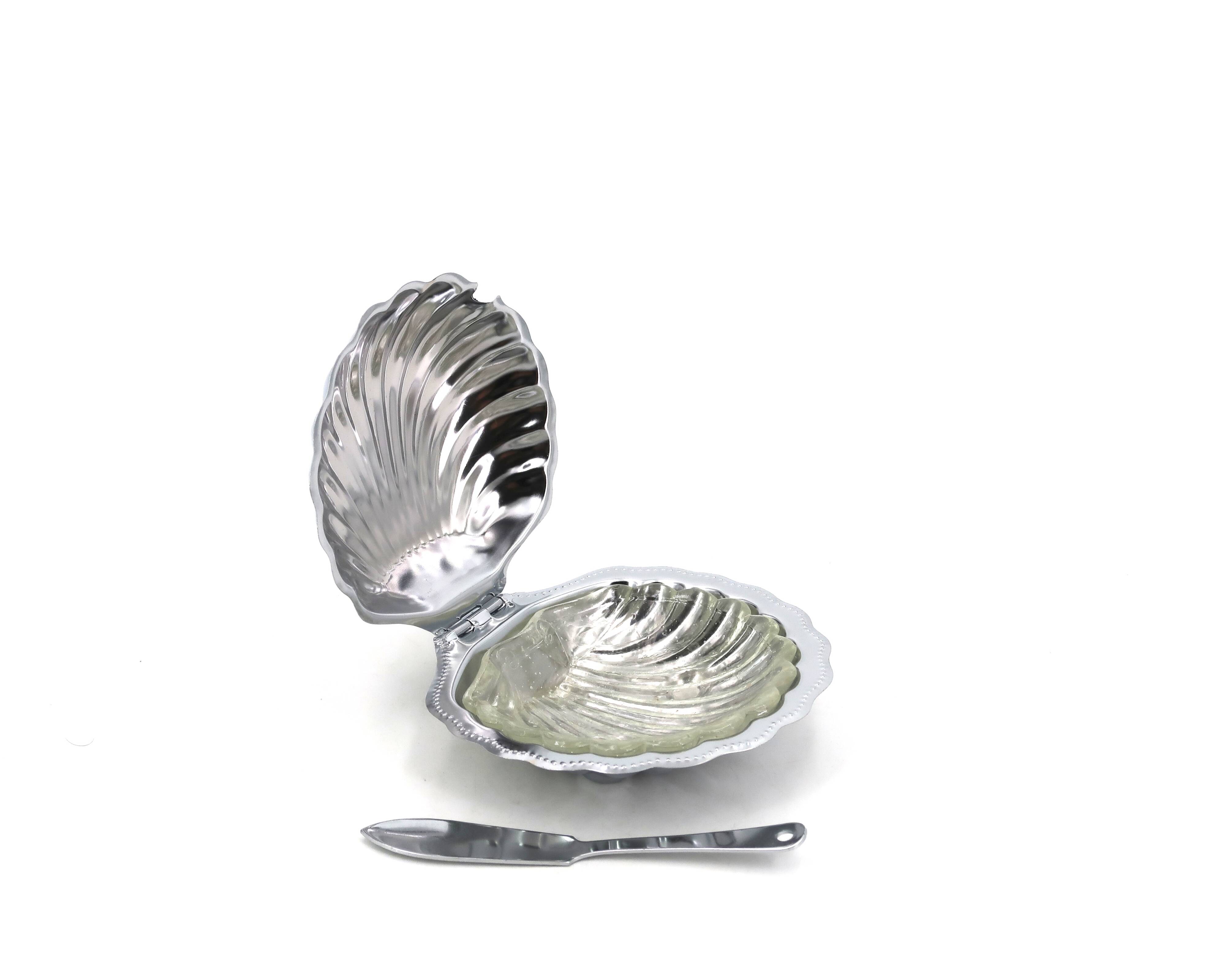 Silver-plated metal and glass shell-shaped butter dish with its knife.