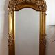 Large antique baroque mirror with angel decorations.