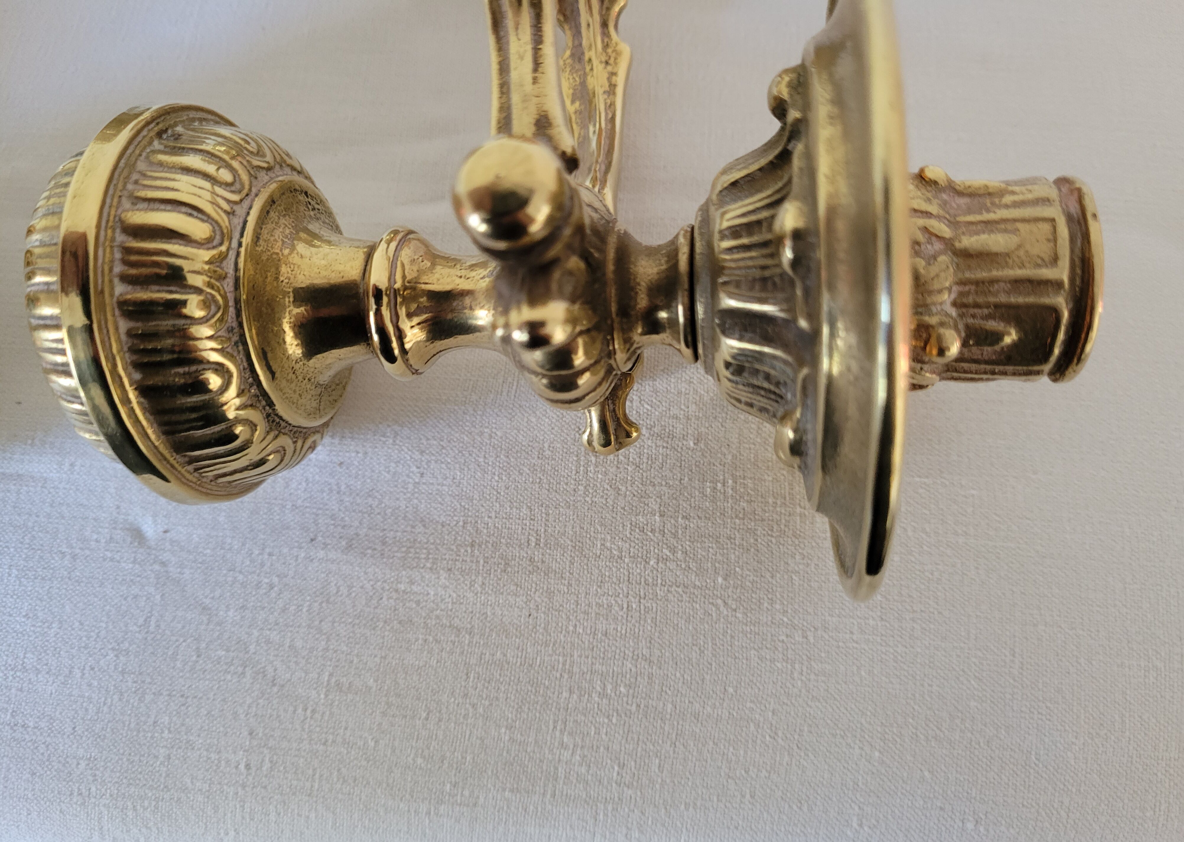 Duo of brass balance wall candle holders