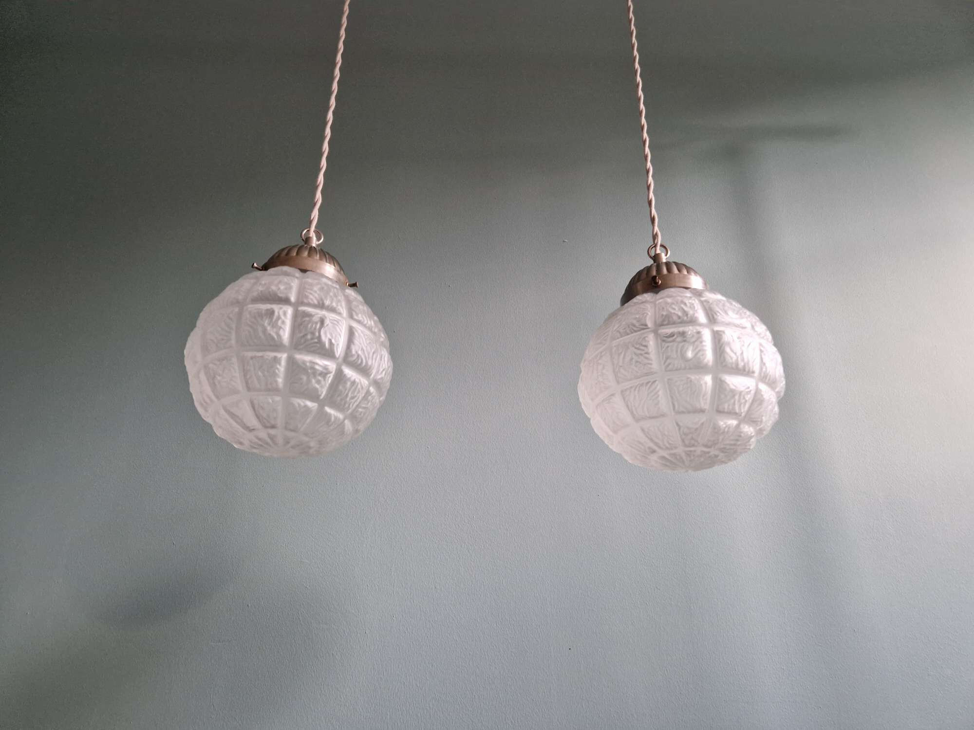 Pair of Art Deco frosted glass pendants, 1920s-30s.