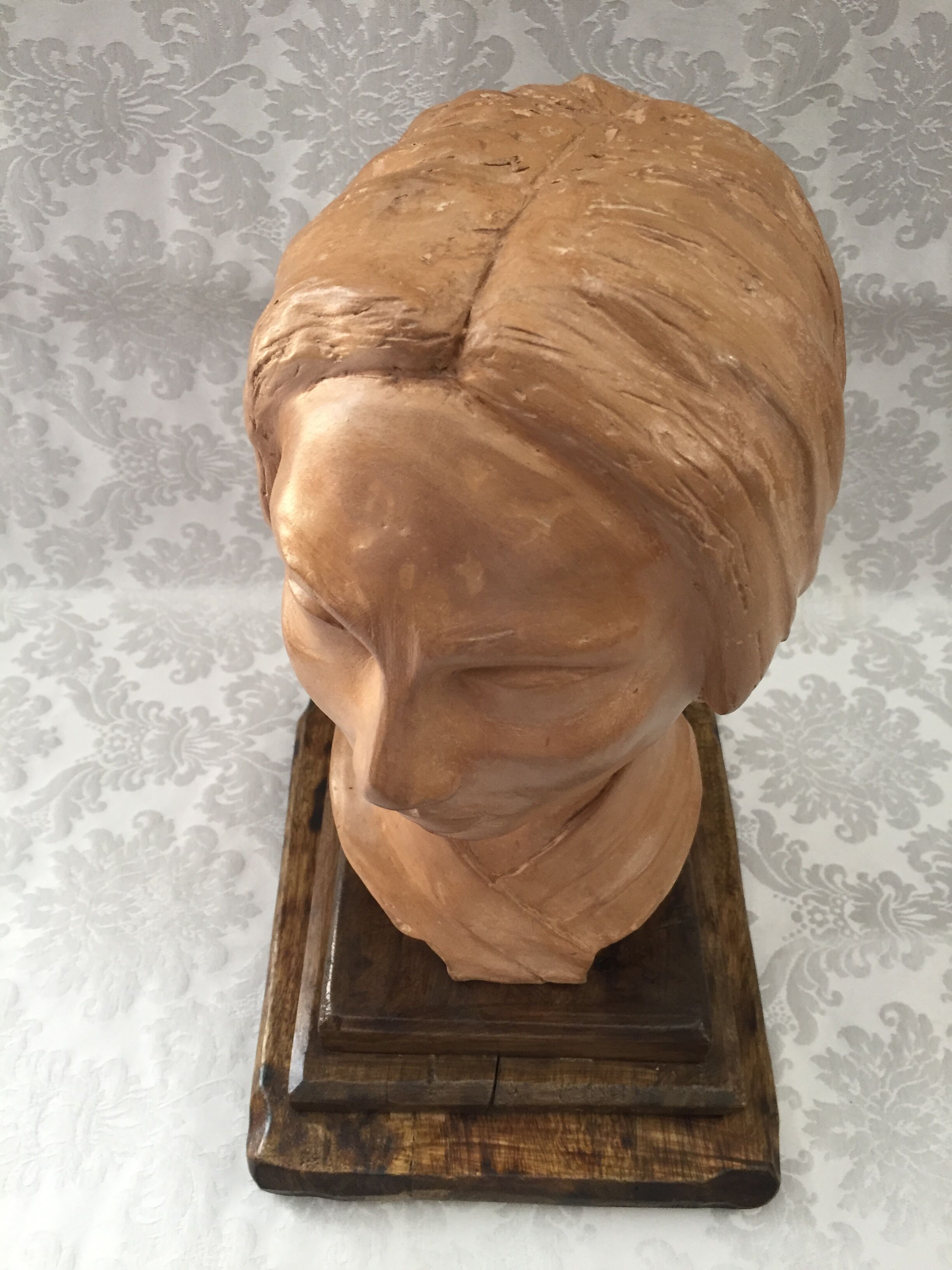 Bust in raw earth of atelier bust face of woman signed j.c.g.