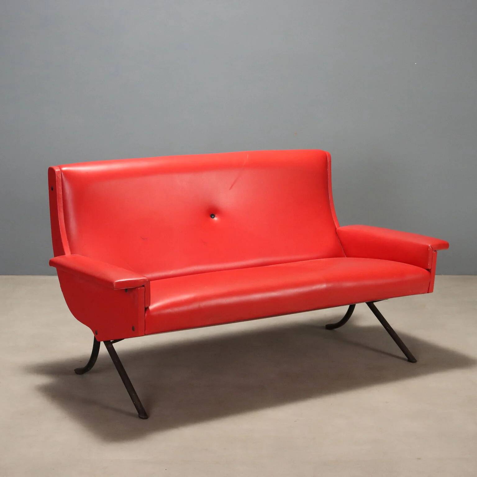 Vintage red faux leather sofa from the 1960s.