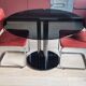 Round black smoked glass dining table + 2 terracotta chairs