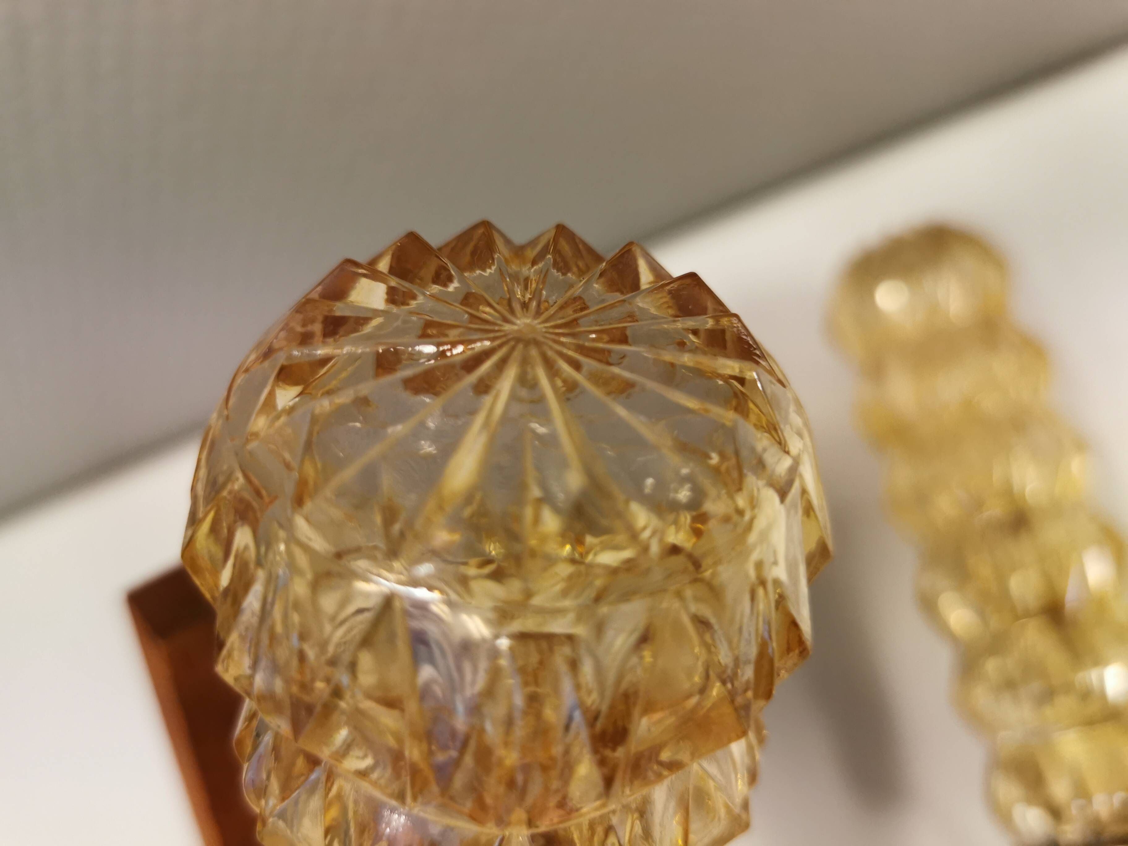 A set of Danish wall lights in champagne coloured glass with brass and teak.