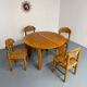 Extendable round table Maison Regain in solid elm, 1970s design.