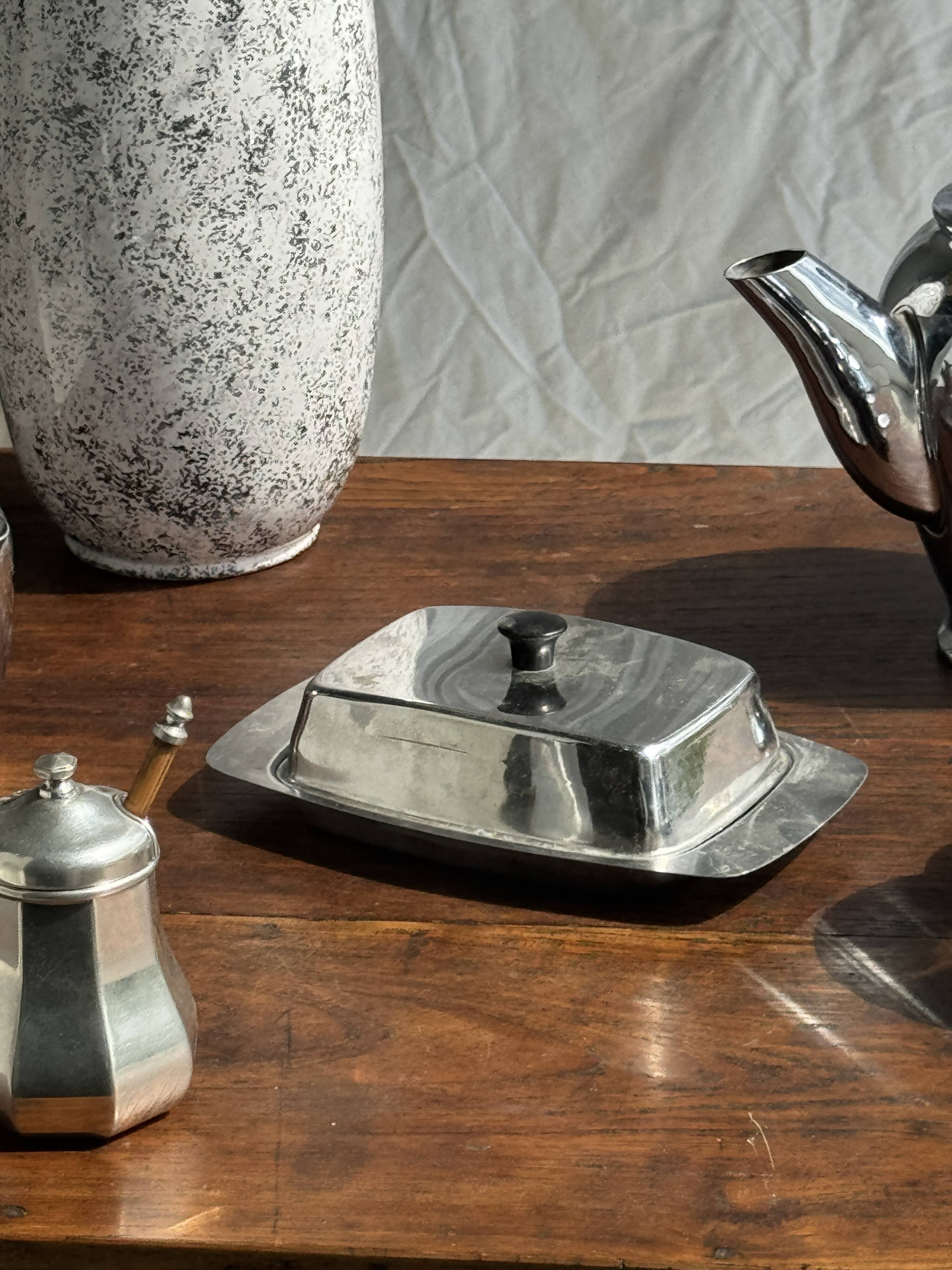 Tea set including teapot, milk jug, sugar bowl and butter dish