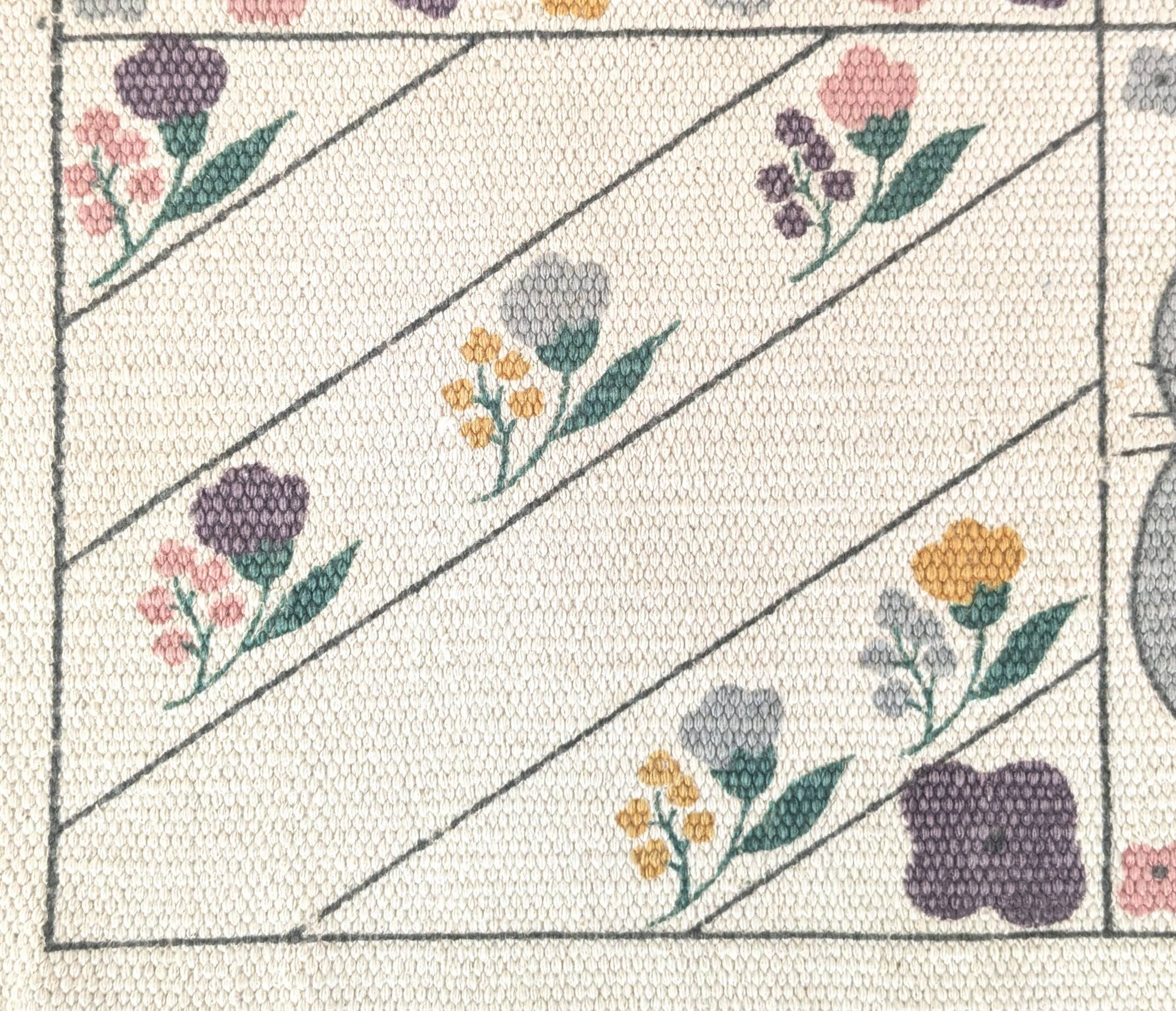 1980s handwoven cotton rug with a cat and flower pattern
