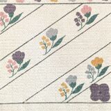 1980s handwoven cotton rug with a cat and flower pattern