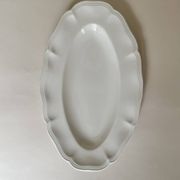 Shaped plates and dishes in Sarreguemines earthenware.