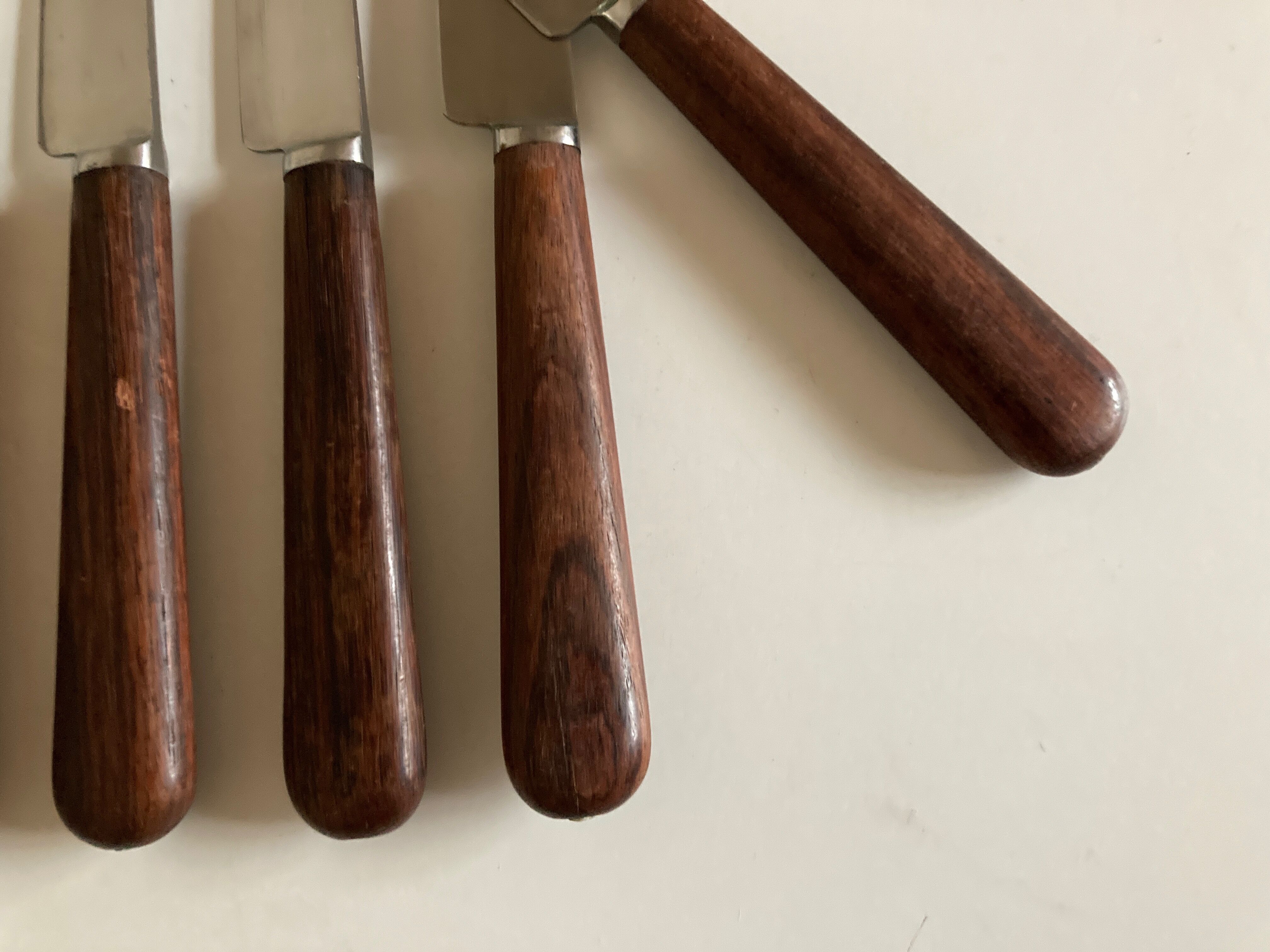 Set of 9 knives with mid century rosewood handle