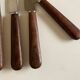 Set de 9 couteaux à manche de bois de palissandre mid century