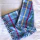 Vintage tablecloth & napkins, blue with multicoloured stripes.