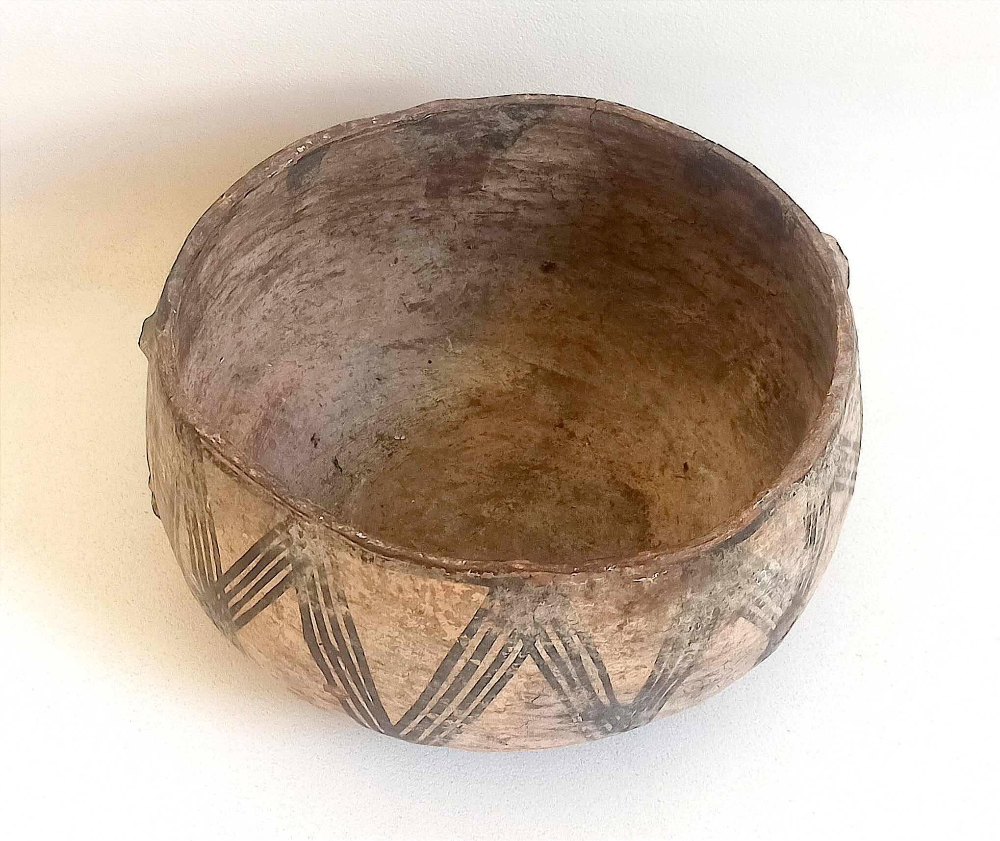 Large ethnic style bowl in orange terracotta, early 20th century