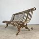Cast iron garden bench from the late 19th century with slatted backrest.