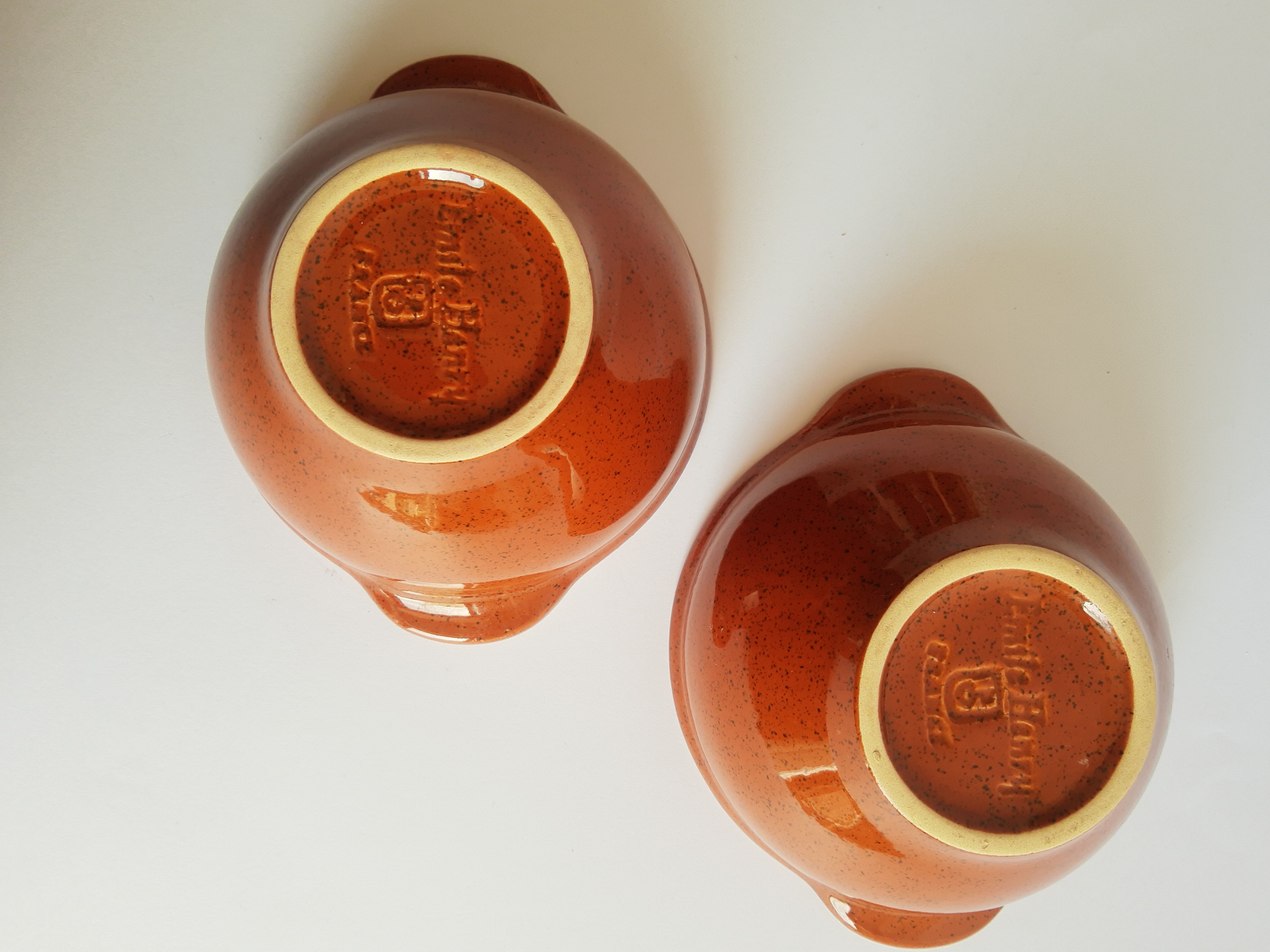 Duo of vintage Emile Henry cognac ear bowls