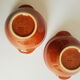 Duo of vintage Emile Henry cognac ear bowls
