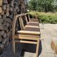 Baumann bench with wooden frame and faux leather seat.