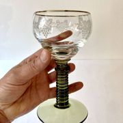7 Alsace Roemer wine glasses, moss green stepped bases and gold trim.