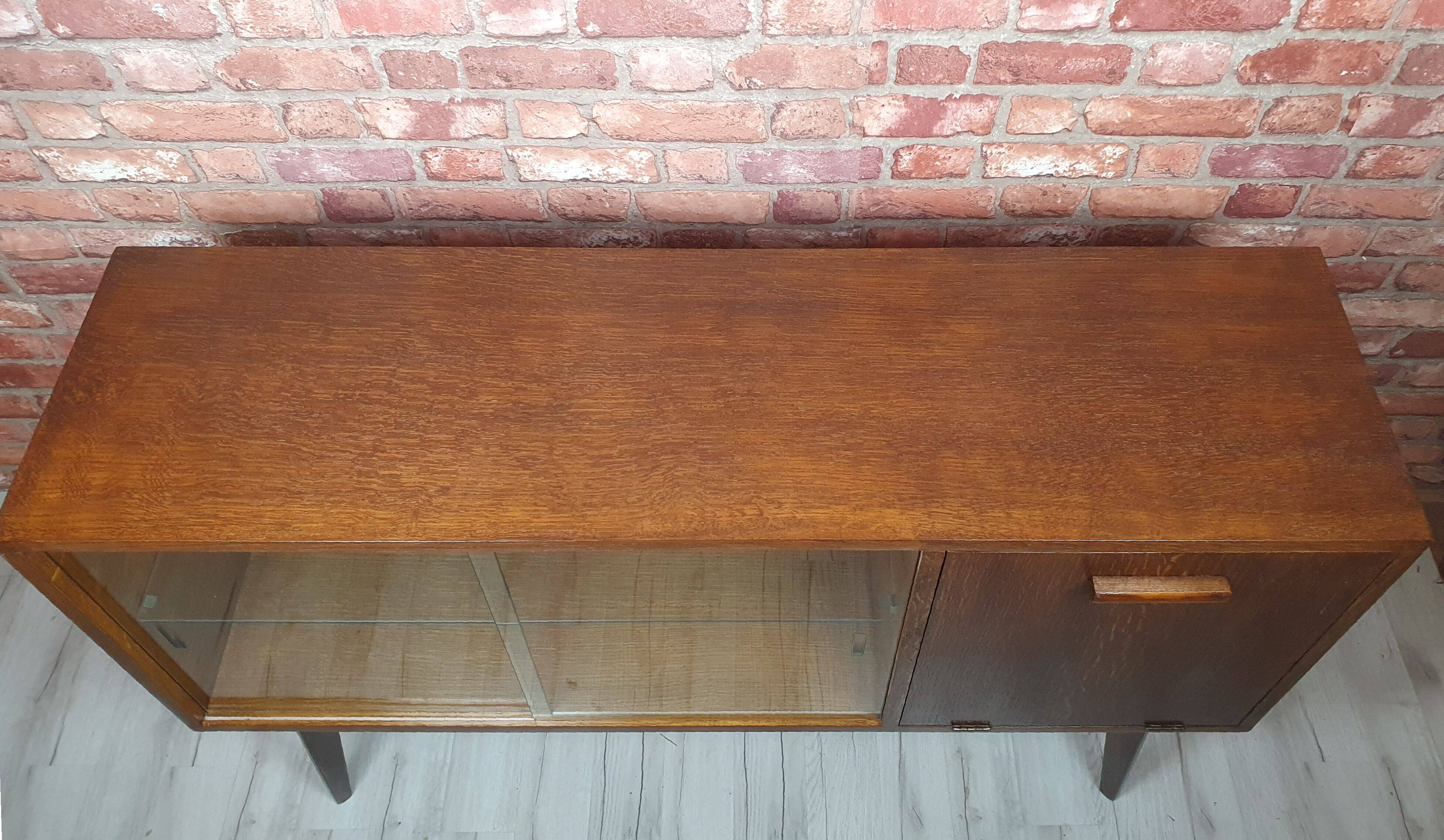Renovated oak display cabinet with a bar on slanted legs