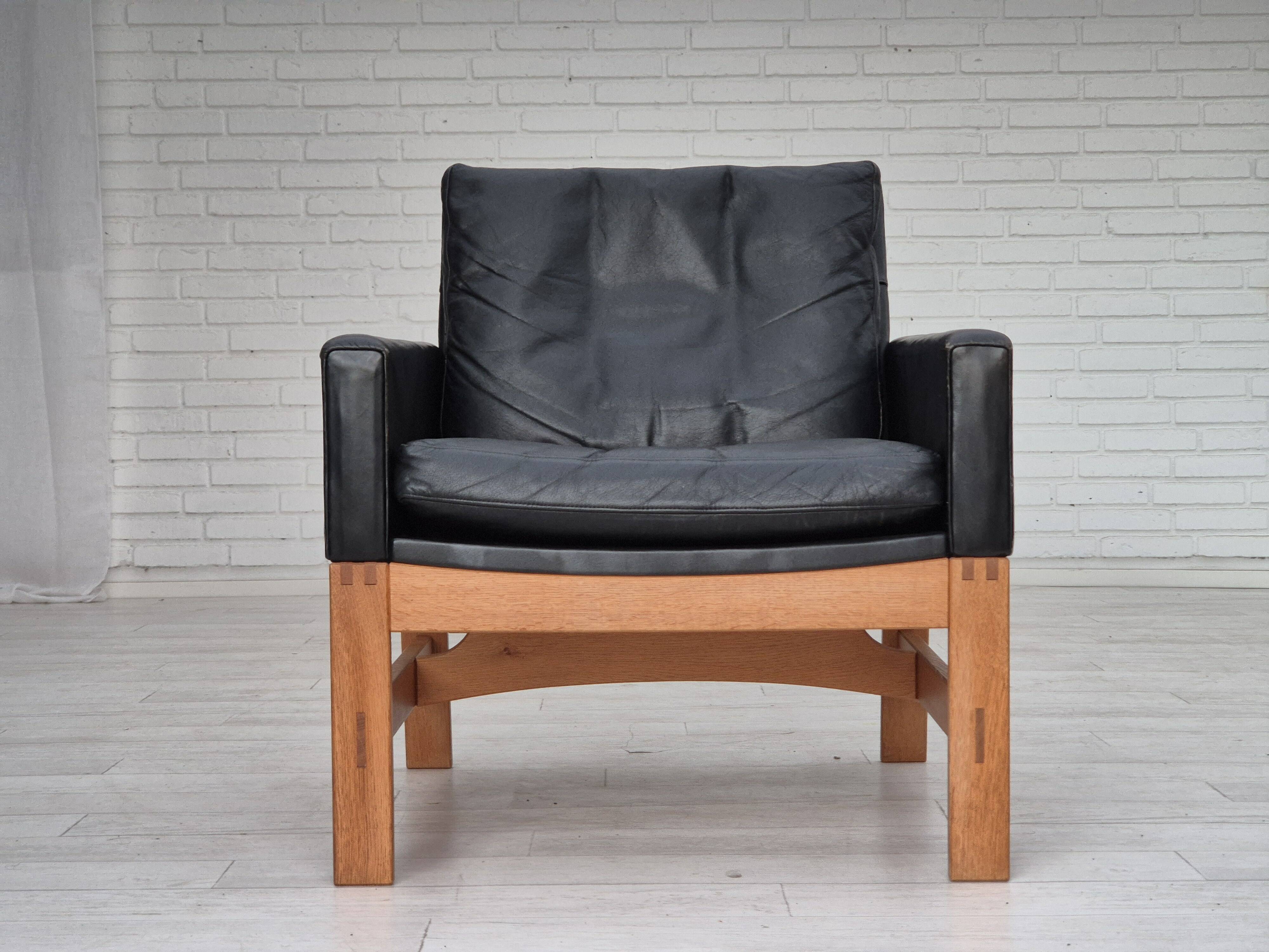 1960s, Danish lounge chair, original condition, furniture leather, solid oak wood.