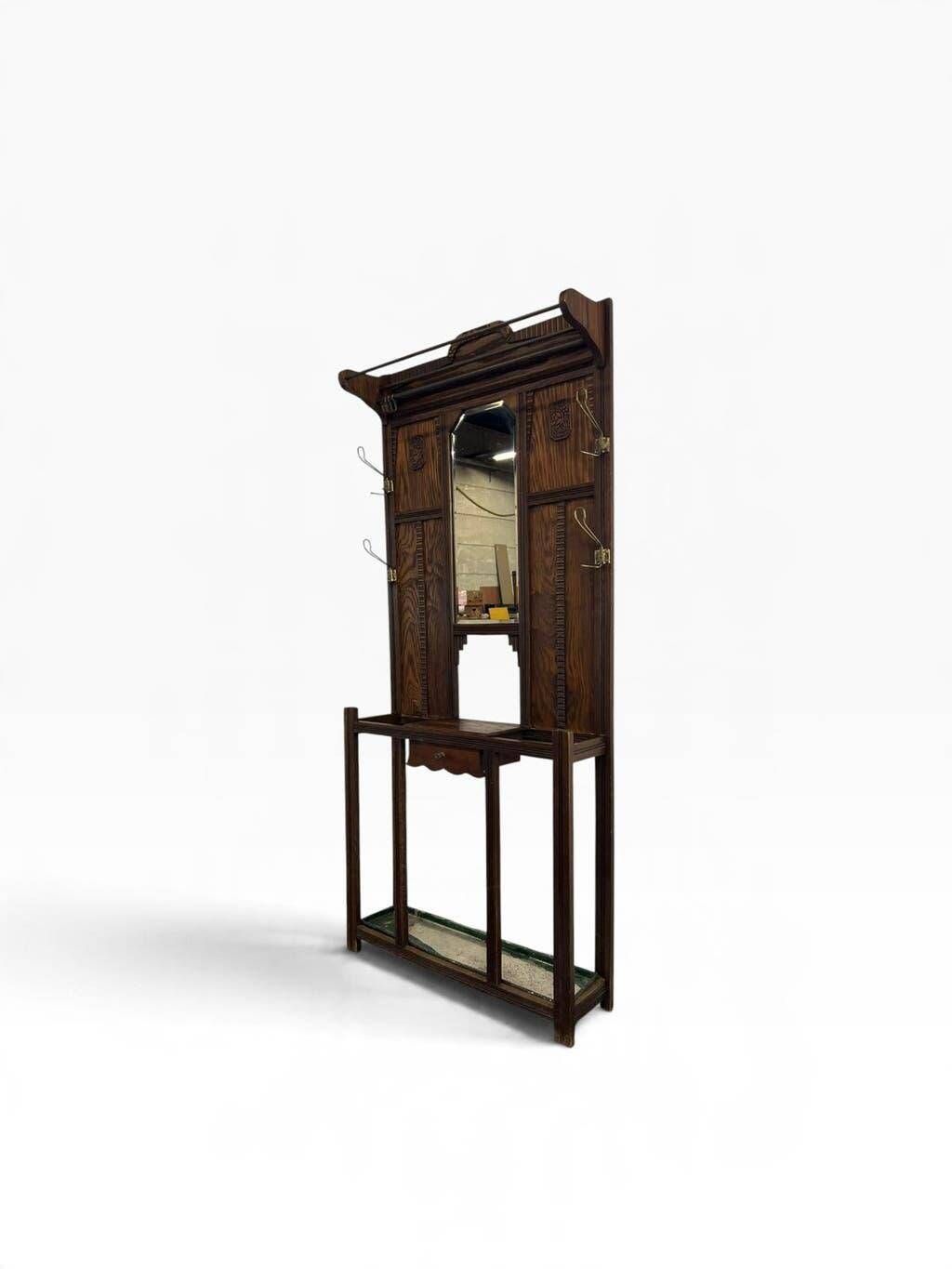 Vintage wooden coat rack with mirror.