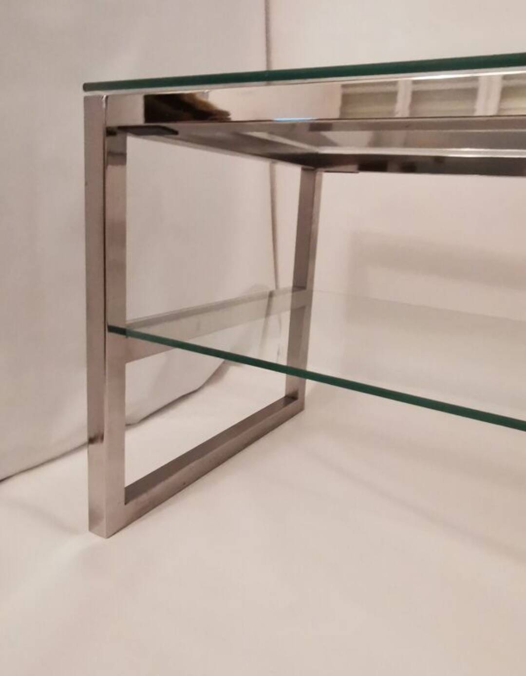 1980s coffee table with a double chrome metal top.