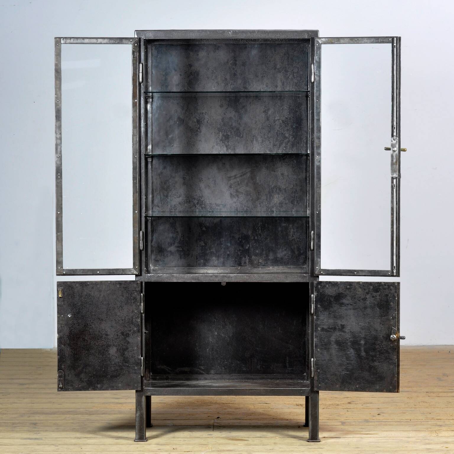 Polished iron medical cabinet, 1920s